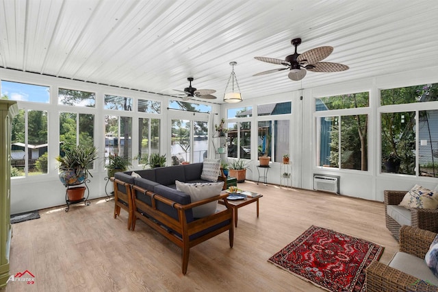 589 County Road 183, Carthage, TX 75633 - sunroom / solarium with wood finished floors, a deck with water view, a wall mounted air conditioner, and wood ceiling