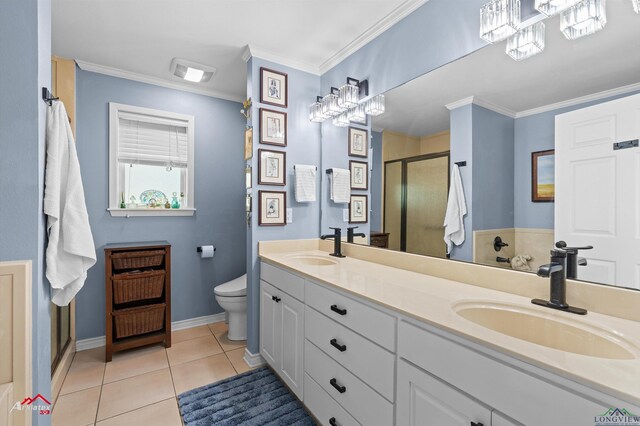 589 County Road 183, Carthage, TX 75633 - bathroom with a shower stall, double vanity, toilet, tile patterned flooring, and baseboards