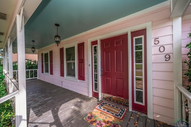 entrance to property with covered porch