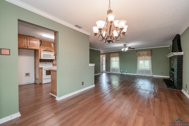 unfurnished living room featuring a textured ceiling, ceiling fan with notable chandelier, crown molding, a fireplace, and dark hardwood / wood-style floors