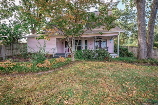 obstructed view of property featuring a porch and a front yard