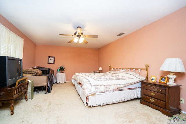 bedroom featuring light carpet and ceiling fan