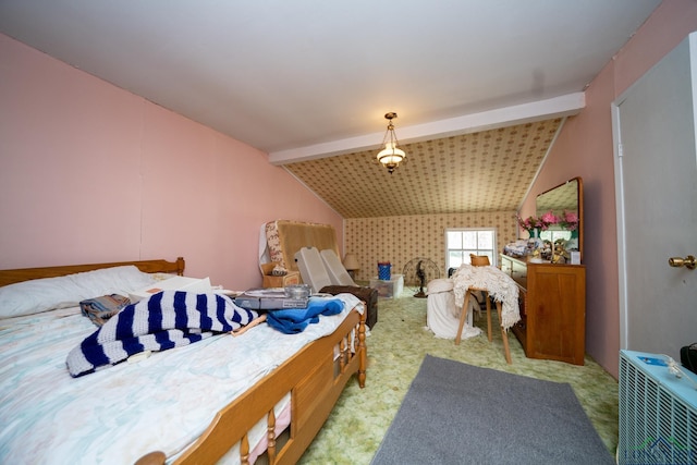 bedroom featuring lofted ceiling with beams