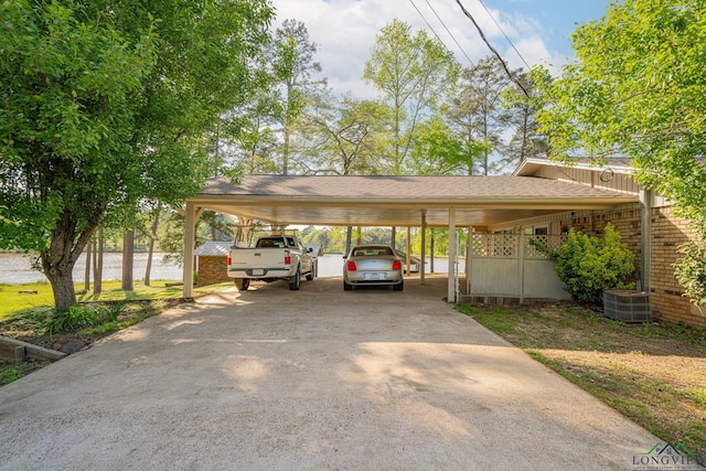316 County Road 2750, Hughes Springs, TX 75656 - view of vehicle parking with driveway and a water view