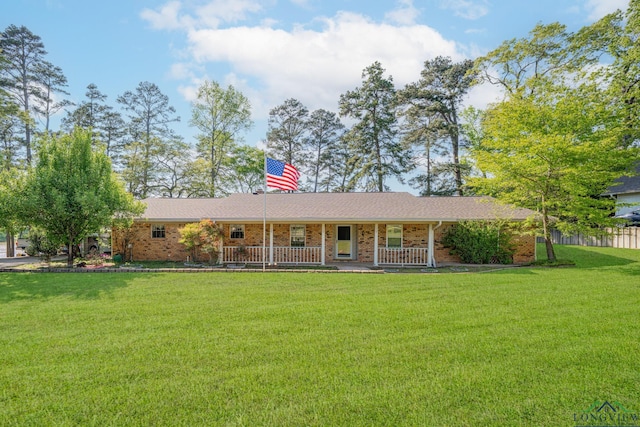 316 County Road 2750, Hughes Springs, TX 75656 - view of front of property with a porch and brick siding