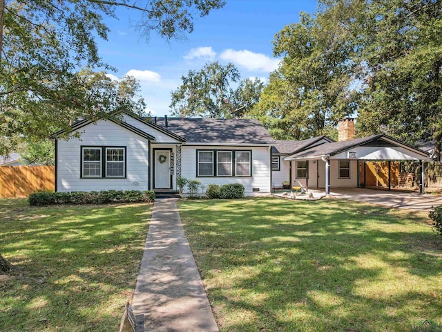 view of front of house with a patio and a front yard