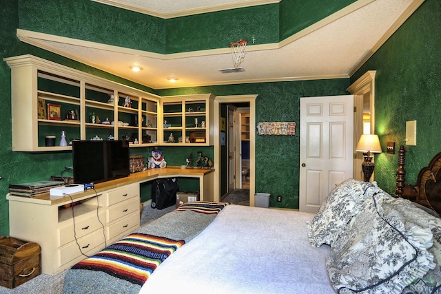 carpeted bedroom featuring a textured ceiling, built in desk, and crown molding