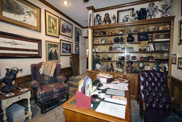 carpeted office space featuring crown molding