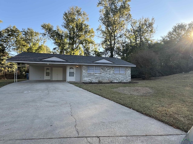 ranch-style house with a front lawn and a carport