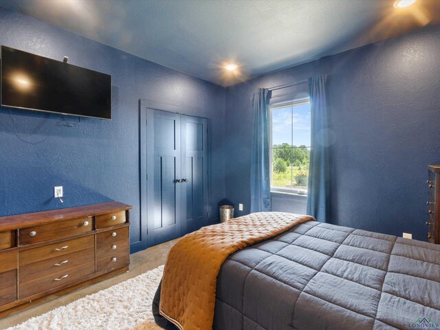 3472 Fm 2869, Hawkins, TX 75765 - carpeted bedroom with a textured wall