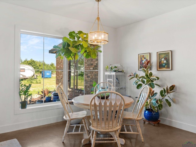 3472 Fm 2869, Hawkins, TX 75765 - dining area featuring a chandelier, baseboards, and finished concrete floors