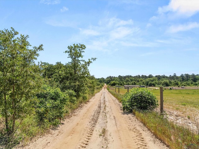 3472 Fm 2869, Hawkins, TX 75765 - view of dirt / gravel road featuring a rural view and a view of trees