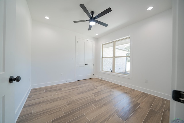 unfurnished room with ceiling fan