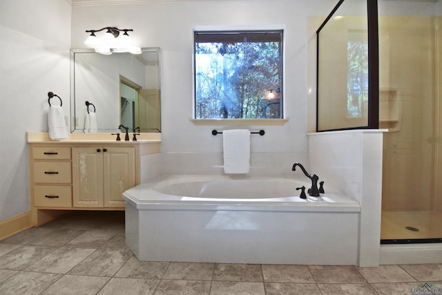 bathroom with vanity and separate shower and tub