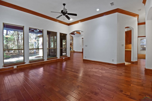 unfurnished living room featuring hardwood / wood-style floors, ceiling fan, and crown molding