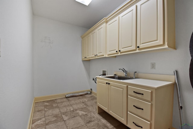 washroom featuring sink, cabinets, and washer hookup