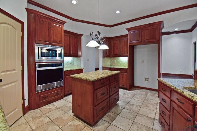 kitchen with crown molding, hanging light fixtures, decorative backsplash, light stone countertops, and appliances with stainless steel finishes