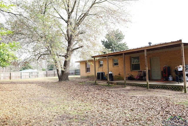 back of house featuring a patio area and central air condition unit