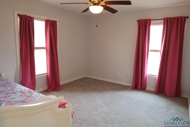 unfurnished bedroom with light carpet and ceiling fan