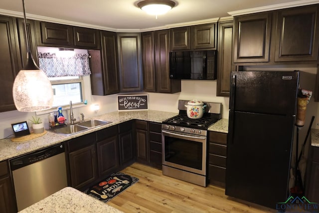 kitchen featuring black appliances, dark brown cabinets, light wood-type flooring, and sink