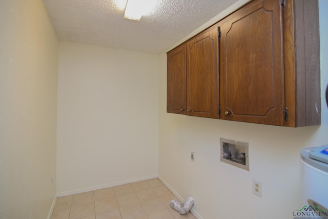 laundry room featuring cabinets, washer hookup, a textured ceiling, electric dryer hookup, and light tile patterned floors