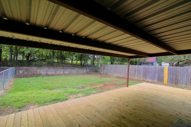 wooden terrace with a yard