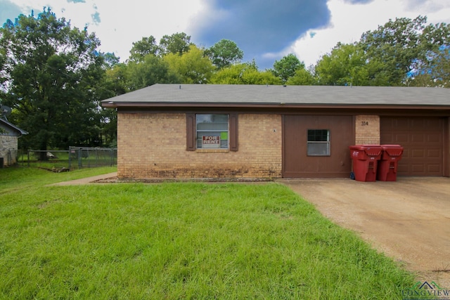 ranch-style house with a front lawn and a garage