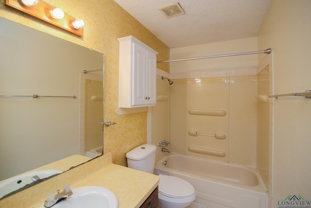 full bathroom with vanity, toilet, a textured ceiling, and bathtub / shower combination