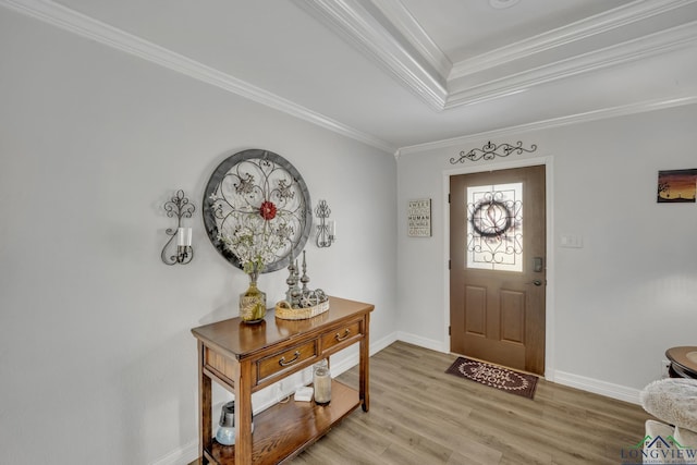 entryway featuring hardwood / wood-style flooring and crown molding