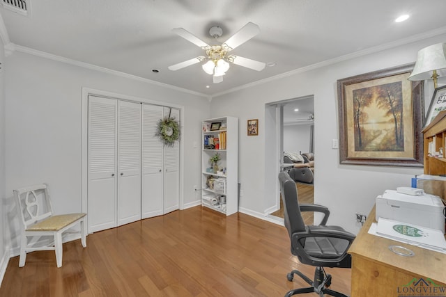 office with wood-type flooring, ornamental molding, and ceiling fan