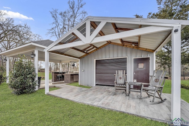 rear view of house featuring a yard and a patio