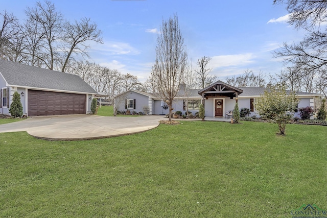 single story home with a garage and a front lawn