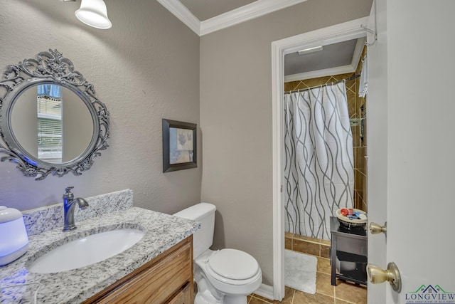 bathroom with crown molding, vanity, and toilet