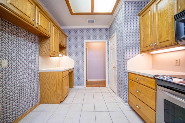 9211 Elm Tree Cir, Tyler, TX 75703 - kitchen with crown molding, light countertops, wallpapered walls, black microwave, and electric stove