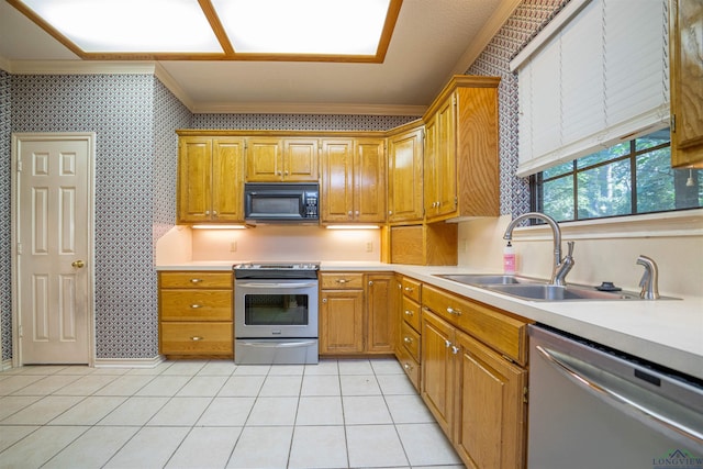 9211 Elm Tree Cir, Tyler, TX 75703 - kitchen with appliances with stainless steel finishes, a sink, ornamental molding, light countertops, and light tile patterned floors