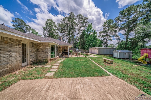 3365 Omie Dr, Longview, TX 75605 - view of yard with a deck and a patio