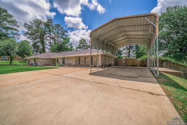 3365 Omie Dr, Longview, TX 75605 - view of parking / parking lot with a carport and concrete driveway