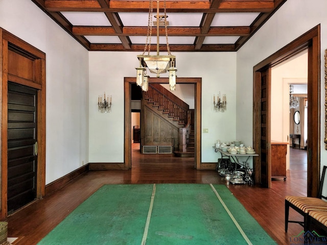 corridor with beamed ceiling, dark wood-type flooring, and coffered ceiling