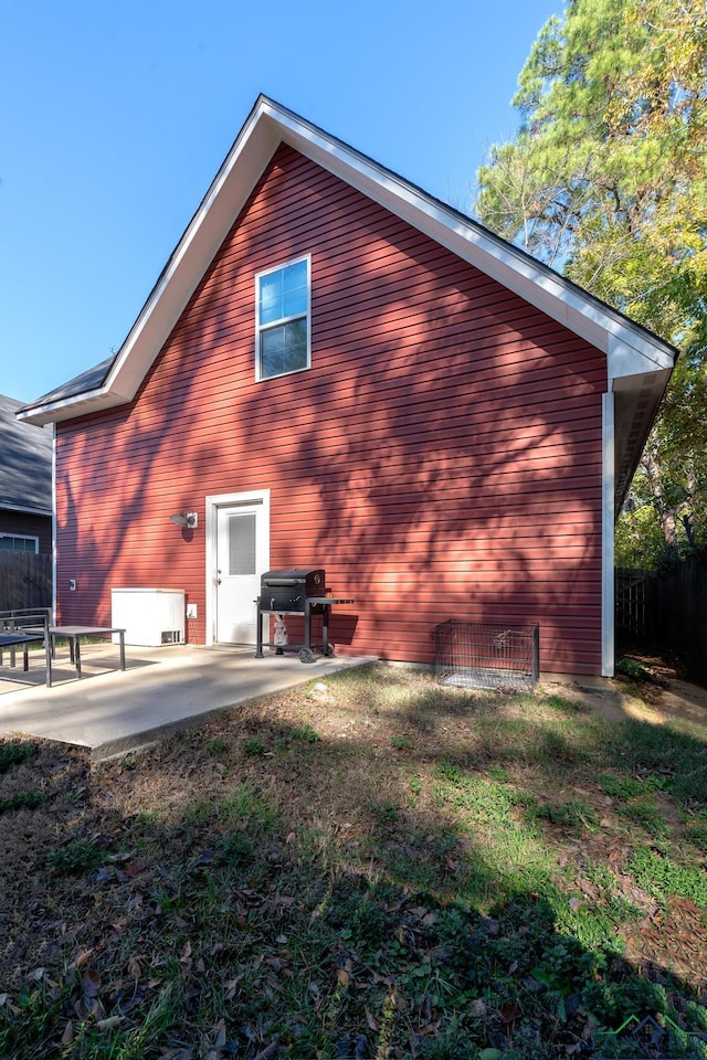 back of house with a patio area