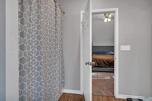 bathroom with wood-type flooring