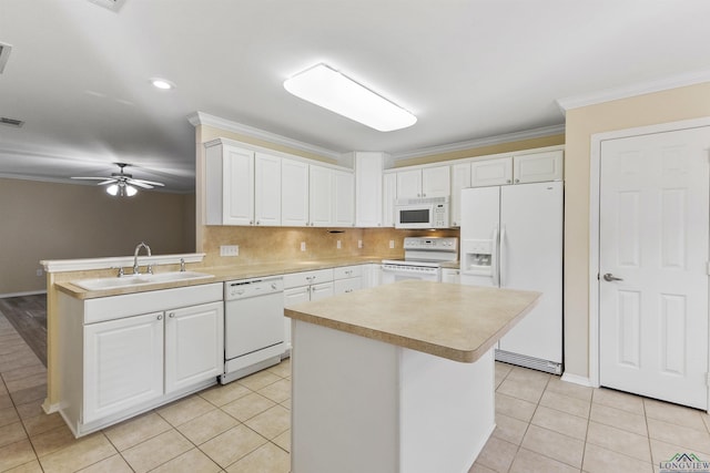 kitchen featuring a center island, white appliances, sink, and white cabinetry