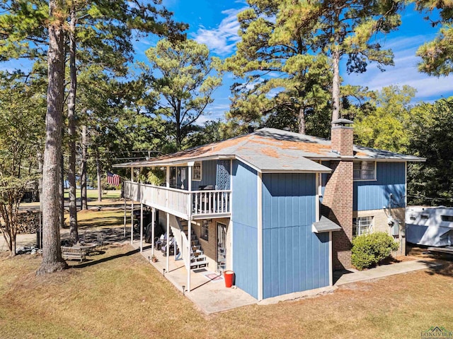 exterior space with a yard, a patio, and a deck