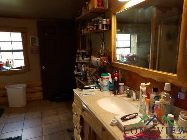 bathroom featuring sink and tile patterned flooring