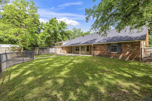 3 Ramblewood Dr, Longview, TX 75605 - back of house with brick siding, a patio, and roof with shingles