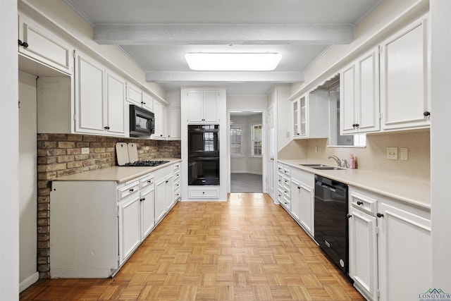3 Ramblewood Dr, Longview, TX 75605 - kitchen with black appliances, a sink, beam ceiling, white cabinetry, and baseboards