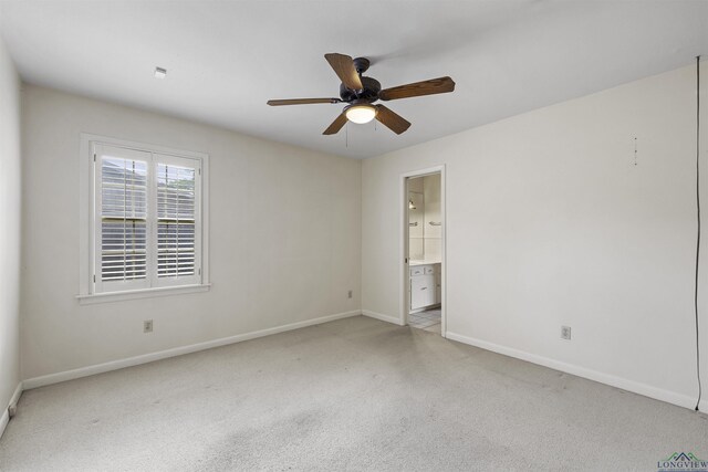 3 Ramblewood Dr, Longview, TX 75605 - unfurnished bedroom with baseboards, light carpet, ensuite bath, and ceiling fan