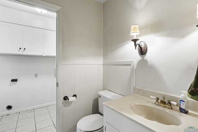 3 Ramblewood Dr, Longview, TX 75605 - bathroom featuring toilet, vanity, wainscoting, and tile patterned flooring