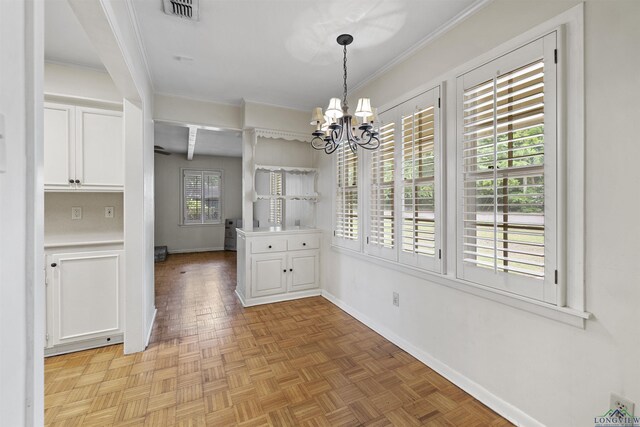 3 Ramblewood Dr, Longview, TX 75605 - unfurnished dining area featuring a chandelier, baseboards, and crown molding
