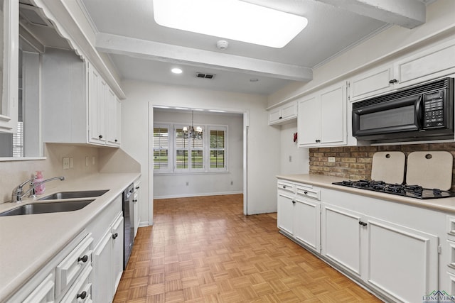 3 Ramblewood Dr, Longview, TX 75605 - kitchen featuring black appliances, a sink, a chandelier, white cabinets, and decorative backsplash