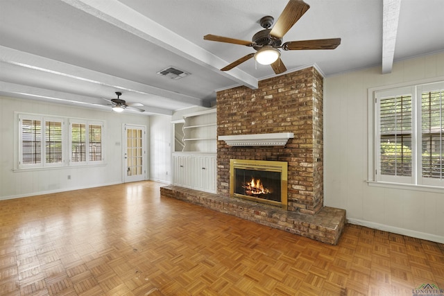 3 Ramblewood Dr, Longview, TX 75605 - unfurnished living room with a ceiling fan, beamed ceiling, baseboards, and a fireplace